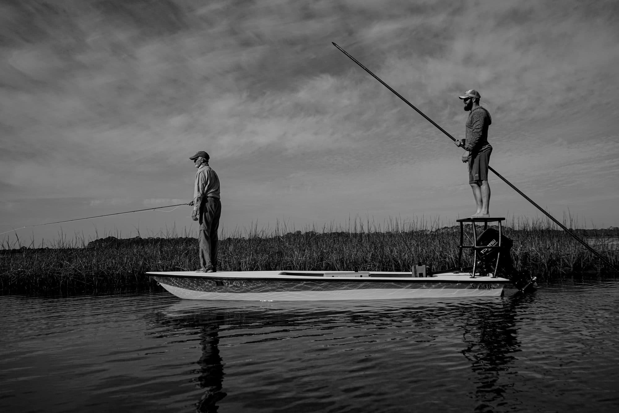 A Spear skiff being poled while an angler casts